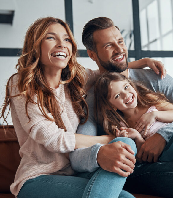 Family laughing together highlighting comfortable, family-friendly dental bridges in Spokane, WA
