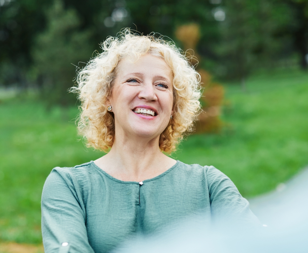 Smiling senior woman with healthy teeth representing Root Canal Therapy in Spokane, WA
