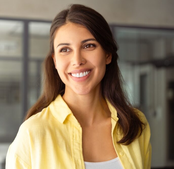 Woman with a bright smile representing general and cosmetic dentistry in Spokane, WA