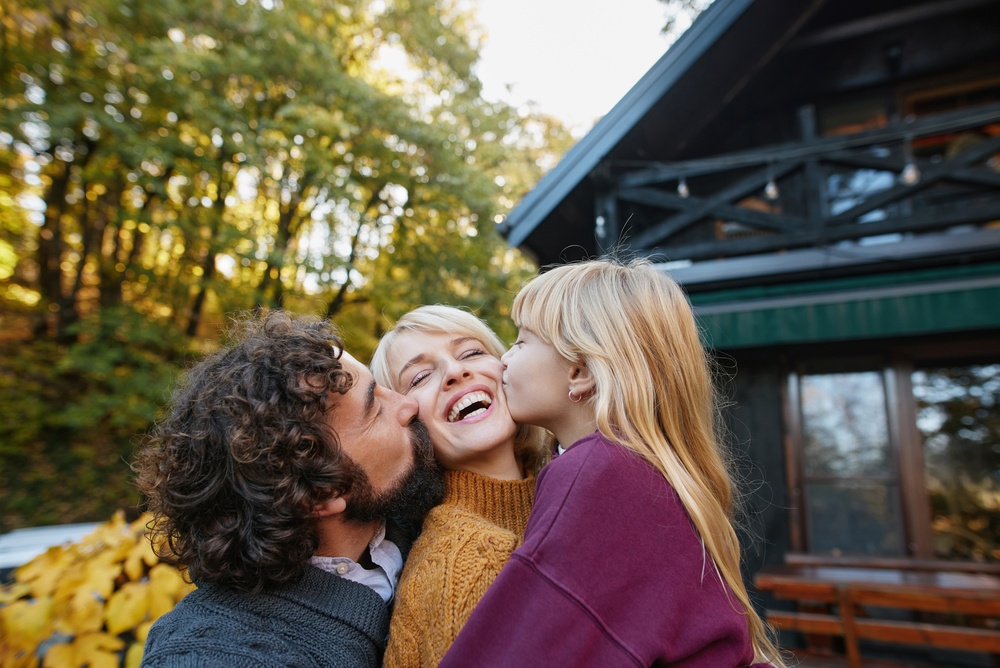 Happy family laughing together showing healthy smiles and Emergency Dental Care in Spokane, WA