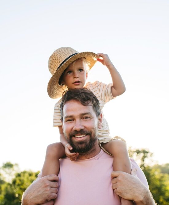Father and child smiling together showing family dentistry care in Spokane, WA